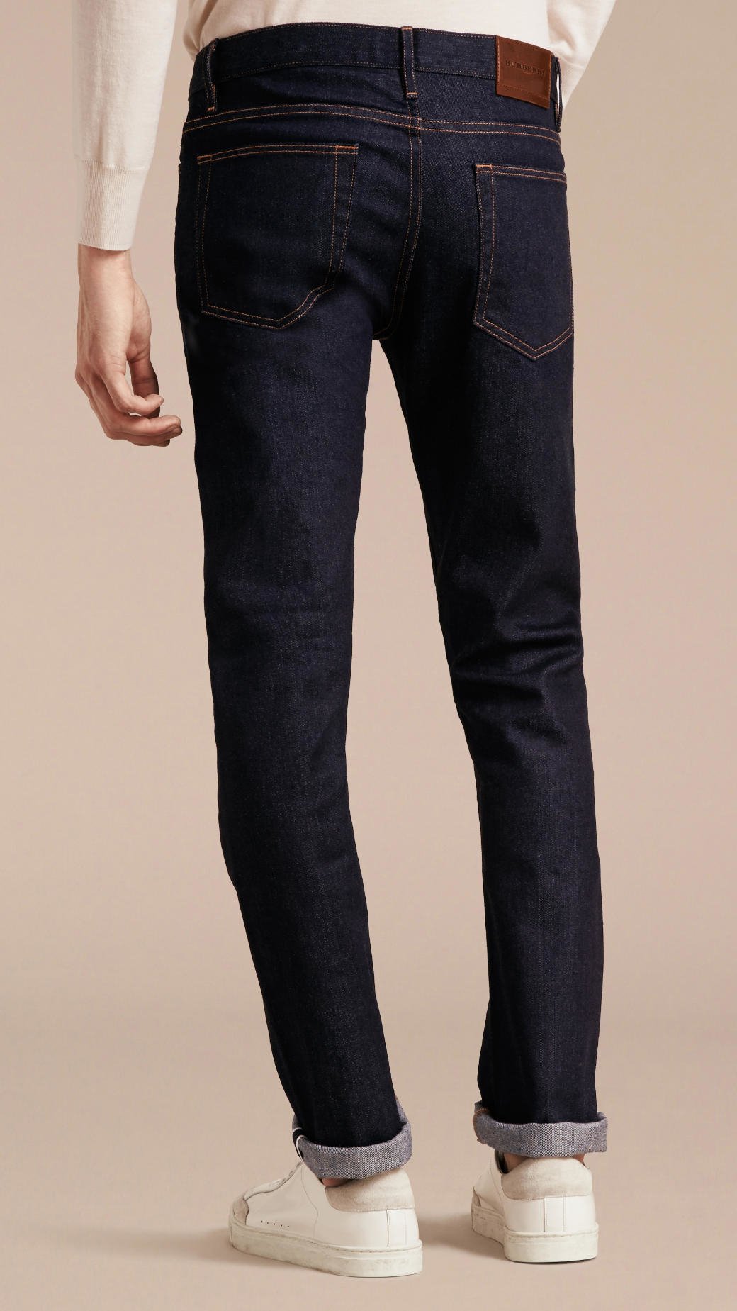 All Listings As the above photograph reveals, the selvedge denim has the white edge with blue thread. This is the “self-edge” of the denim. A non-selvedge jean will need a merrow stitch (or cleaning stitch) on this edge to keep the denim from unraveling.